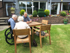 care home residents in garden