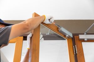 Automatic swing door being serviced